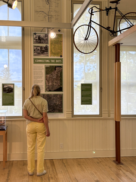 Person looking at artifacts in the gallery