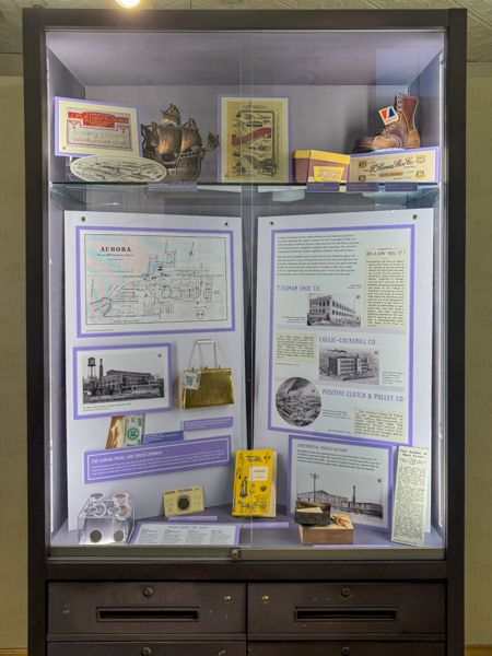 Display case in Aurora room, showing historical artifacts