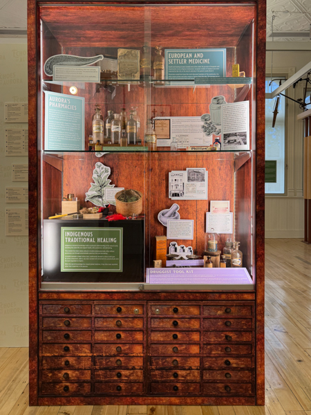 Display case in Aurora room, showing historical artifacts