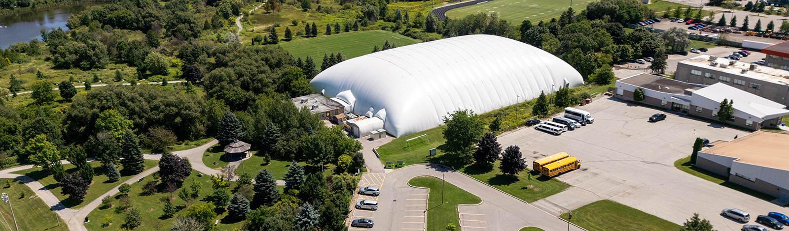 Drone aerial shot of the Front of building Aurora Sports Dome