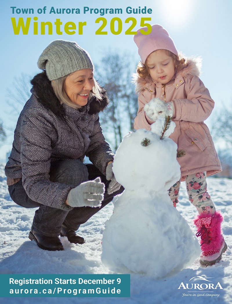 Grandmother and grandchild making snowman