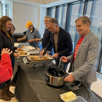 Mayor and Councillors serving food to residents