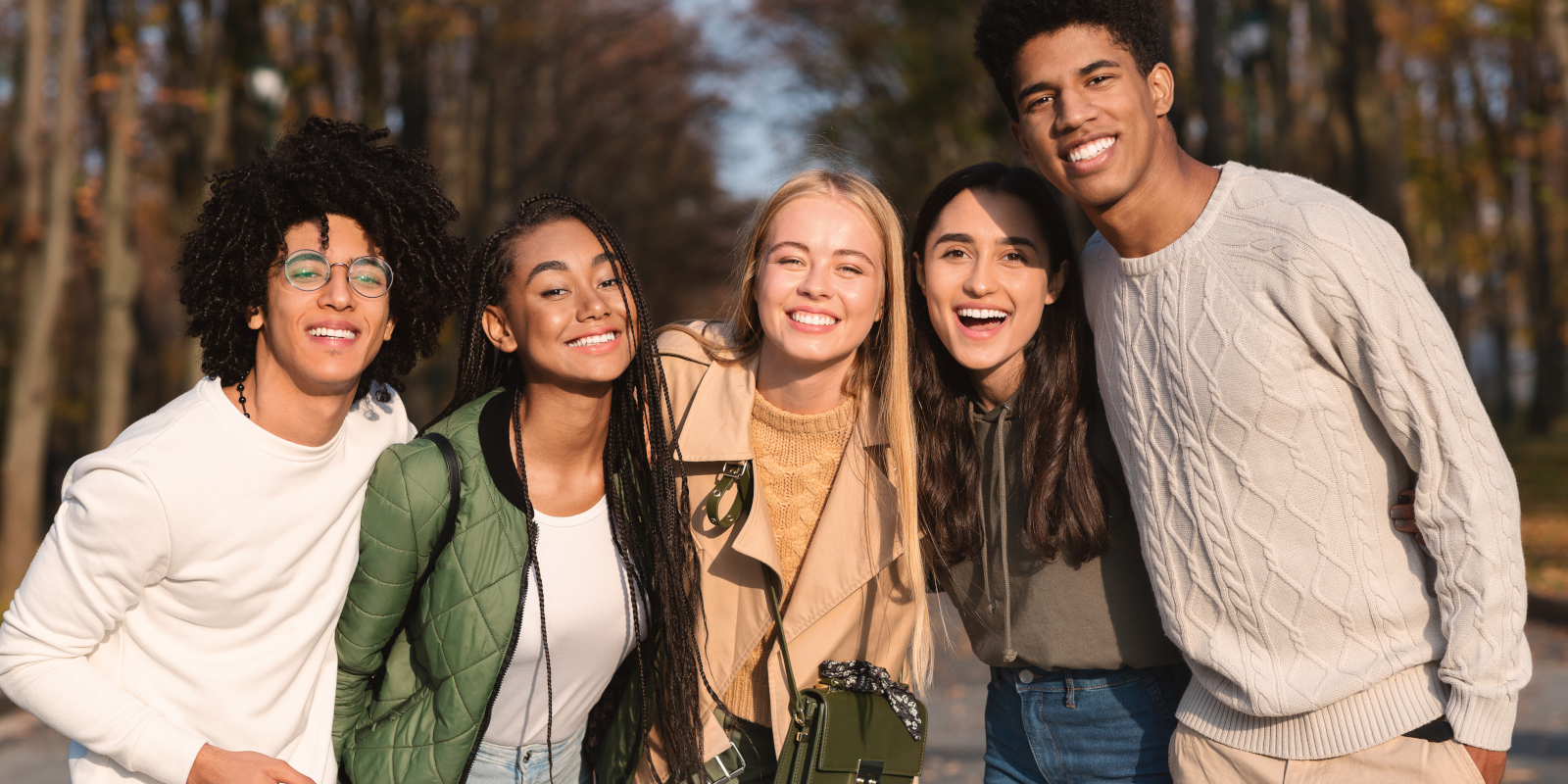 Five youth hanging out together fall season weather