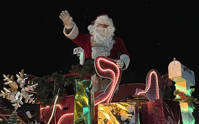 Santa Claus on sled in the evening sky