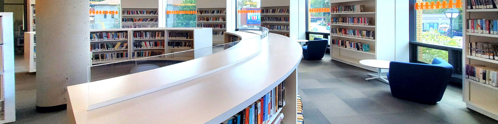 The book shelves and cozy seating in Aurora Public Library