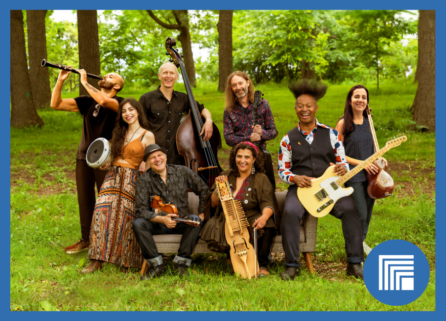 6 musicians sitting outside holding their instruments