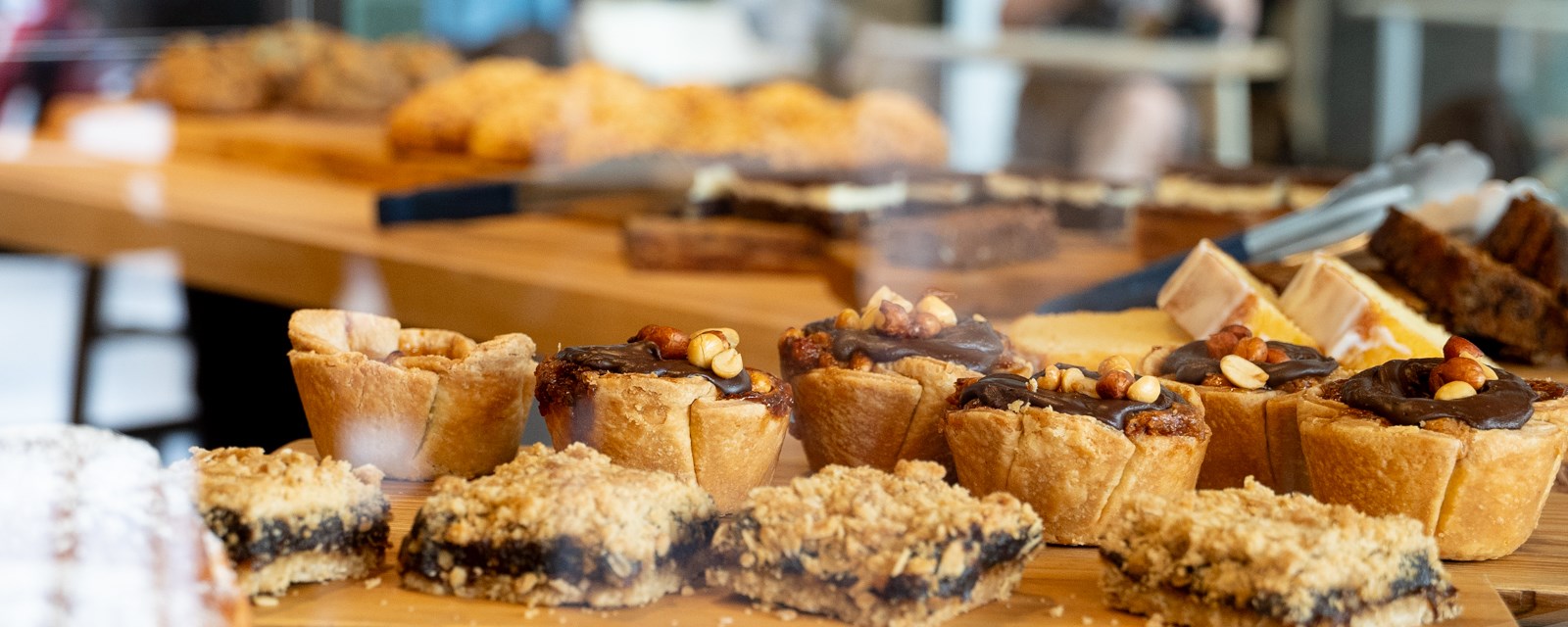 Assortment of baked goods behind a glass display