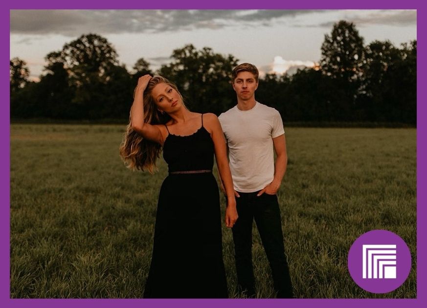 The Beresfords, brother and sister duo. Standing in a dark green field.